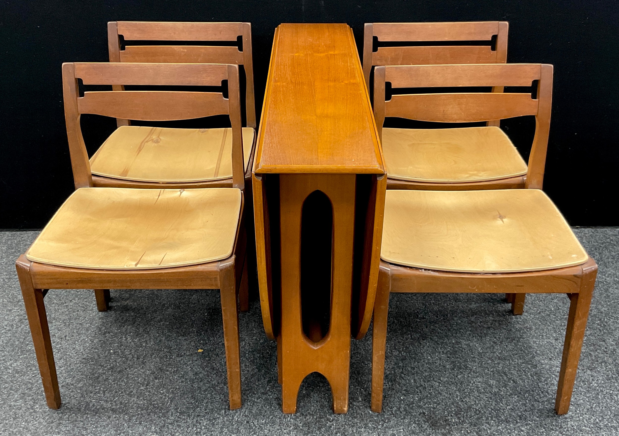 A Nathan teak drop-leaf dining table with matching set of four mid century design chairs, (5).