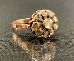A 19th century and later rose cut diamond cluster ring, set with ten mixed and rose cut diamonds,