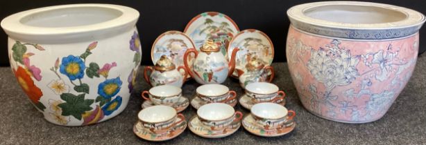 A Japanese export egg shell porcelain six setting tea set, painted with traditional figures; two