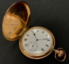 A Waltham Royal 9ct gold hunter cased pocket watch, white enamel dial, bold Roman numerals,