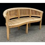 Garden furniture - a teak ‘Half-moon’ shaped three seat garden bench, 85cm high x 159cm wide x