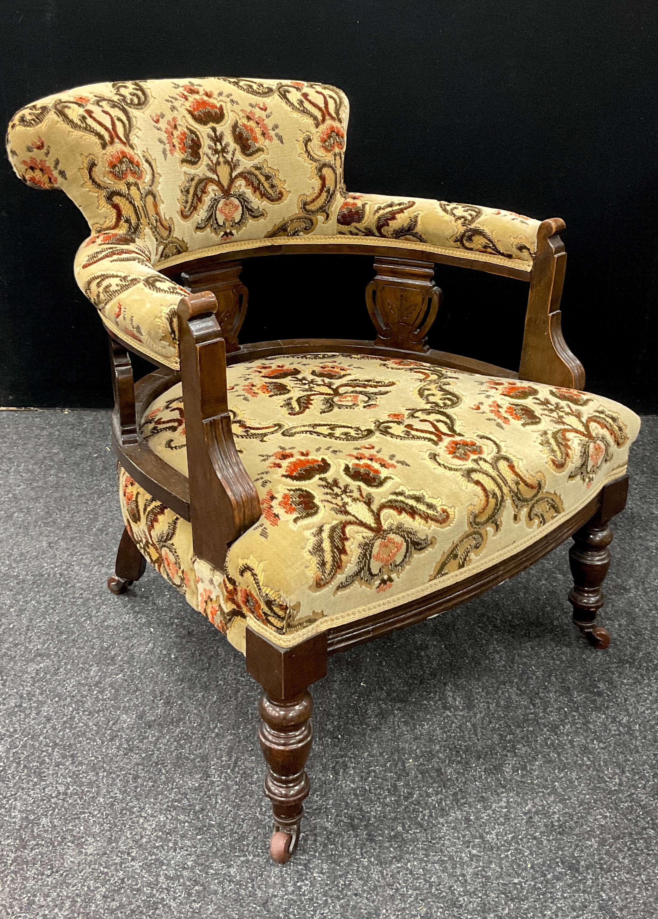 A Victorian inlaid tub chair, floral upholstery, turned fore legs