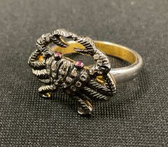 An unusual diamond novelty ring, as a crab, pave encrusted with rose cut diamonds, ruby eyes,