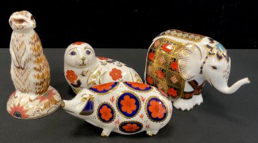 Royal Crown Derby paperweights including; Elephant, Seal, Meerkat and pig, mostly gold stoppers (4)