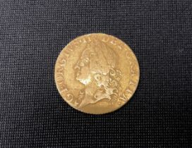 A George II half guinea gold coin, 1752, crowned quartered shield 4.1g