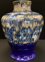 A large Cobridge Stoneware exhibition piece Seine pattern vase, decorated with wavy bands of blue,