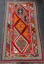 A South-west Persian Qashgai Kilim rug / carpet, hand-knotted in vibrant colours, central row of
