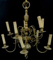 A Dutch style brass ten arm chandelier with two sets of five graduated scrolling arms, 86cm drop,