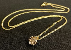 A diamond pendant, certified round brilliant cut diamond. approx 1.0ct, colour fancy light brown,