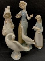 Lladro figures including; ‘Maiden with goose’ 23cm high, ‘Hooded girl’ 21cm high, ‘Girl holding pig’