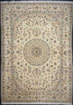 A Persian carpet, central circular floral medallion, within floral garden field, multi-layer