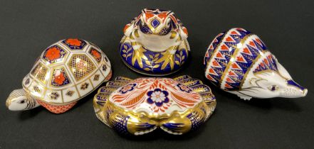 Royal Crown Derby paperweights including; Tortoise, Hedgehog, Crab and Frog, all gold stoppers (4)