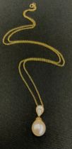 A diamond and culture pearl pendant necklace, pear drop bale set with nine round brilliant cut