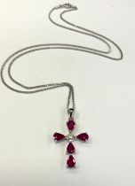 A ruby and diamond cross pendant necklace, set with five pear pinky red rubies, approx 2.51ct