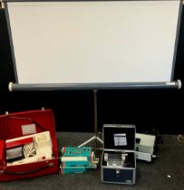 A Bernina Record sewing machine, red portable case; Hanimex slide projector, screen, slide cases,