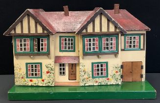 A vintage mid 20th century two storey dolls house with assorted furniture, 43cm x 68cm x 42cm