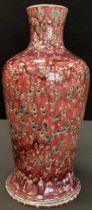 A Cobridge Stoneware Justin Emery Alchemist red mottled bottle vase, impressed marks, 31.5cm high.