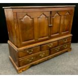 An 18th century and later oak mule chest/cabinet, 108cm high x 137.5cm wide x 48cm deep.
