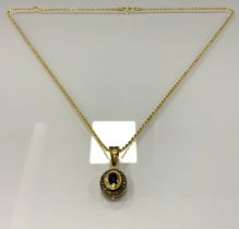 A Victorian style oval sapphire and rose cut diamond pendant necklace, gold and white metal coloured