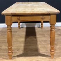 A pine farmhouse kitchen table, 76.5cm high, 170cm wide, 82cm deep