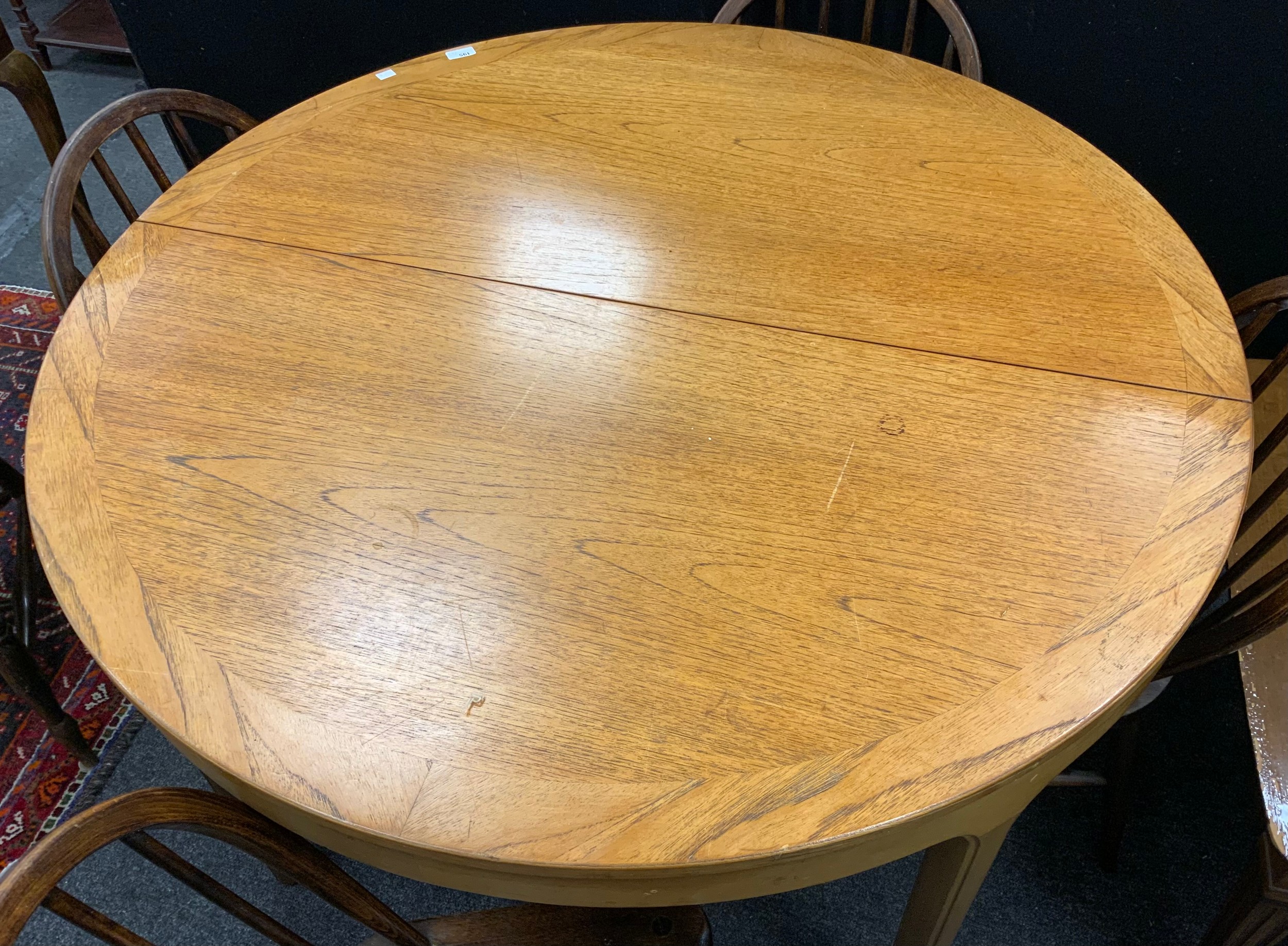 A Nathan Furniture extending dining table, 75cm high x 122cm diameter; with a set of four mid 20th - Image 2 of 3