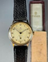 Tudor Rolex - a 1950s 9ct gold cased wristwatch, 31mm diameter case, with textured dial, Arabic