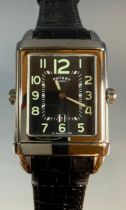 A Rotary Revelation quartz dual-faced wristwatch, revolving reversable case, black rectangular dial,