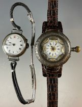 An early 20th century 935 continental silver cased wristwatch, white dial, Roman numerals, gilt