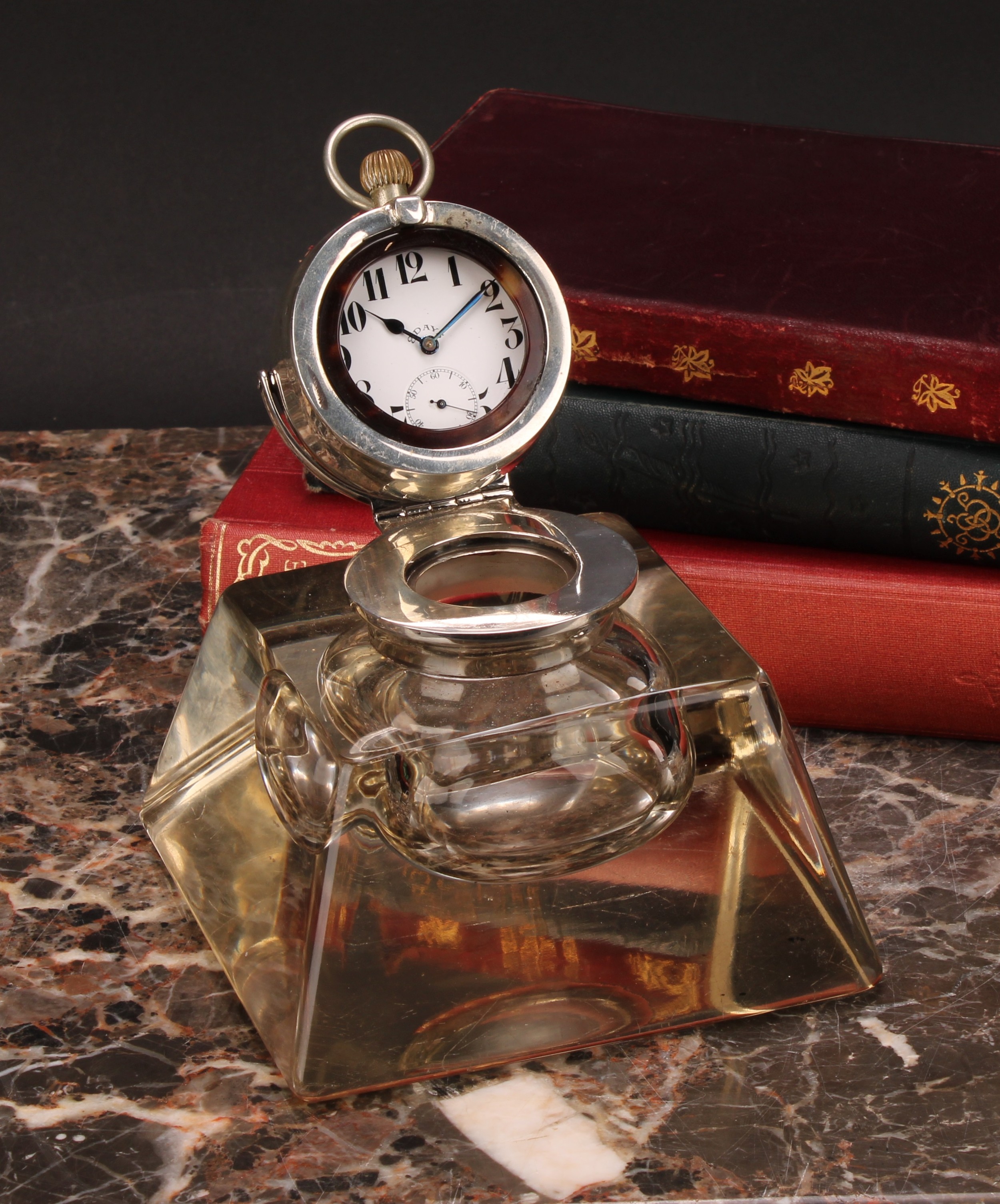 An Edwardian silver mounted combination inkwell and pocket watch holder, hinged cover with