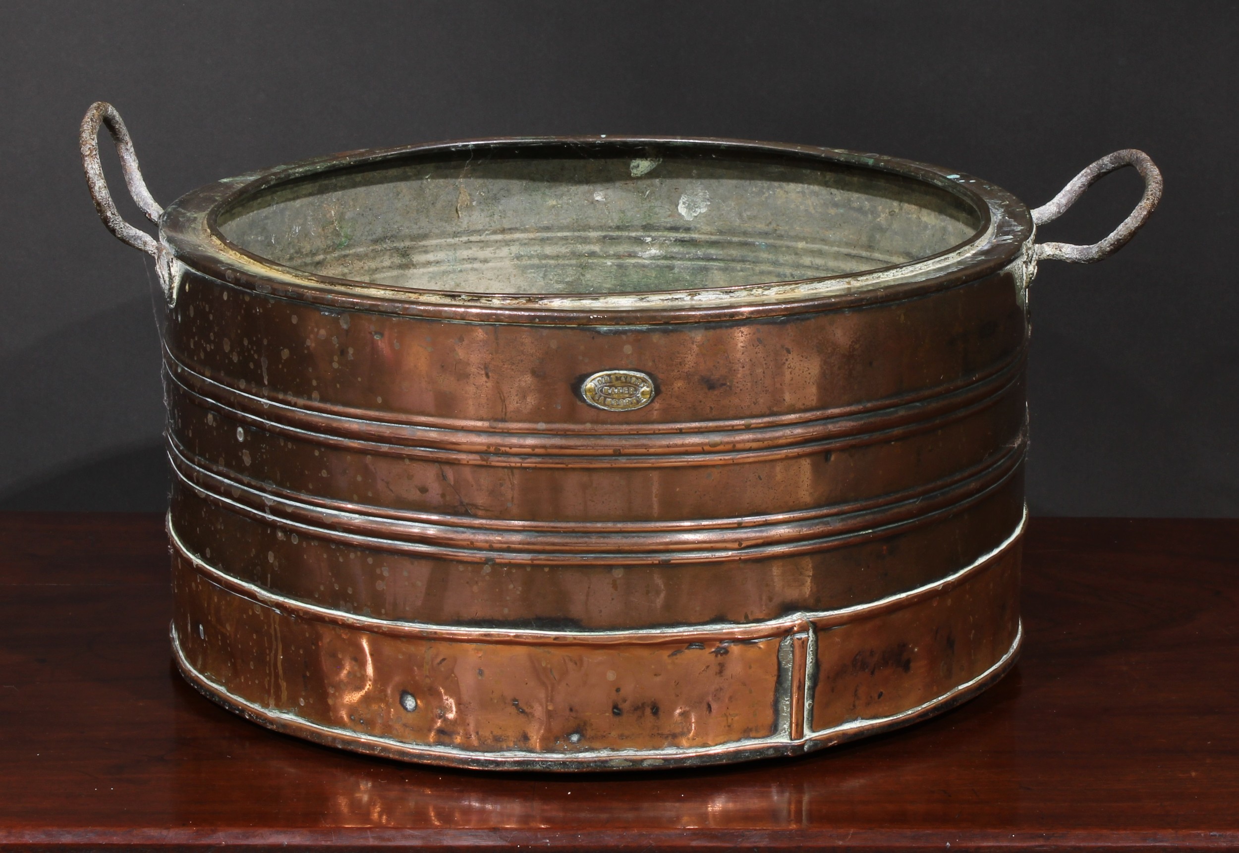 A 19th century copper vessel, by John Libby, Camborne, iron carry handles, 45.5cm wide overall