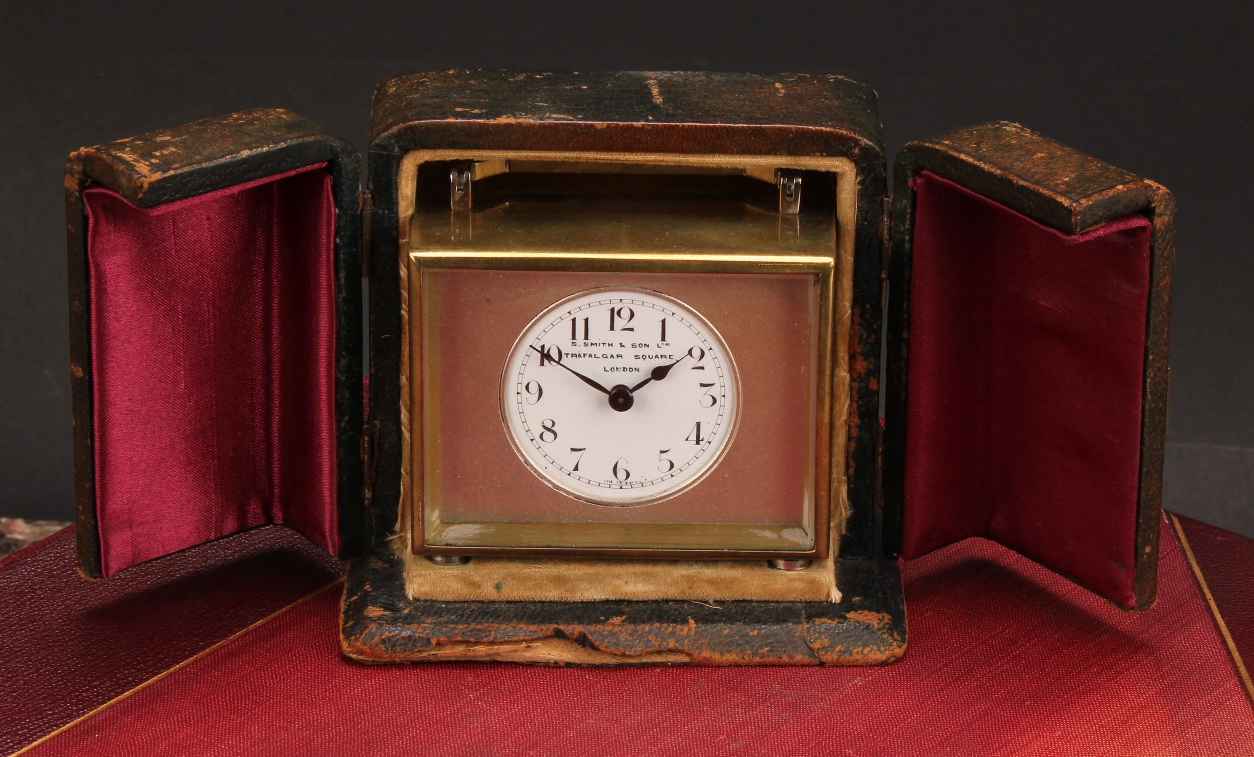 An early 20th century lacquered brass carriage timepiece, 4cm circular enamel dial inscribed S Smith