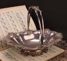 A Transitional period Old Sheffield Plate fluted shaped oval swing-handled cake basket, the border