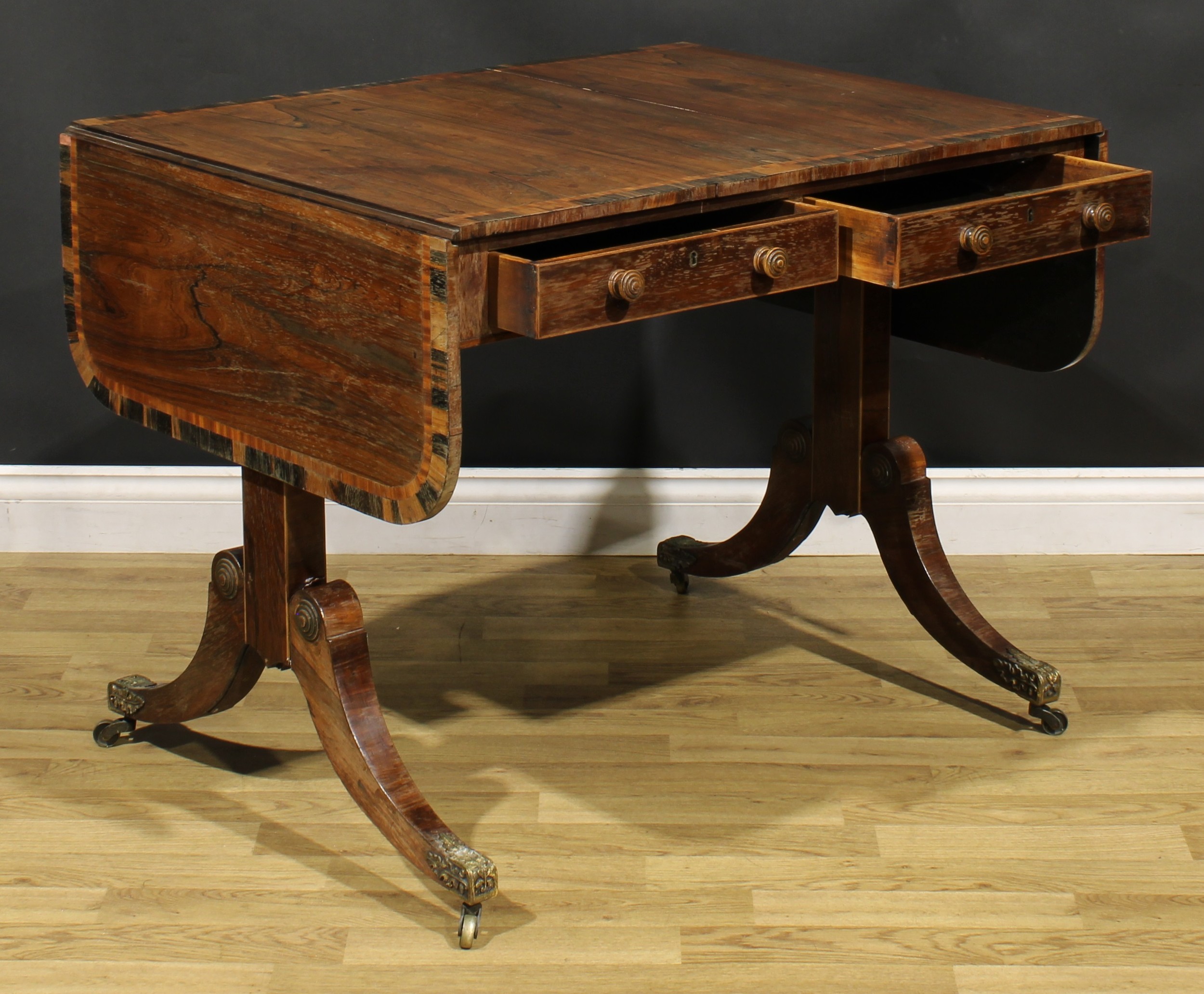 A Regency rosewood sofa table, crossbanded rounded rectangular top with fall leaves, above a pair of - Image 5 of 7