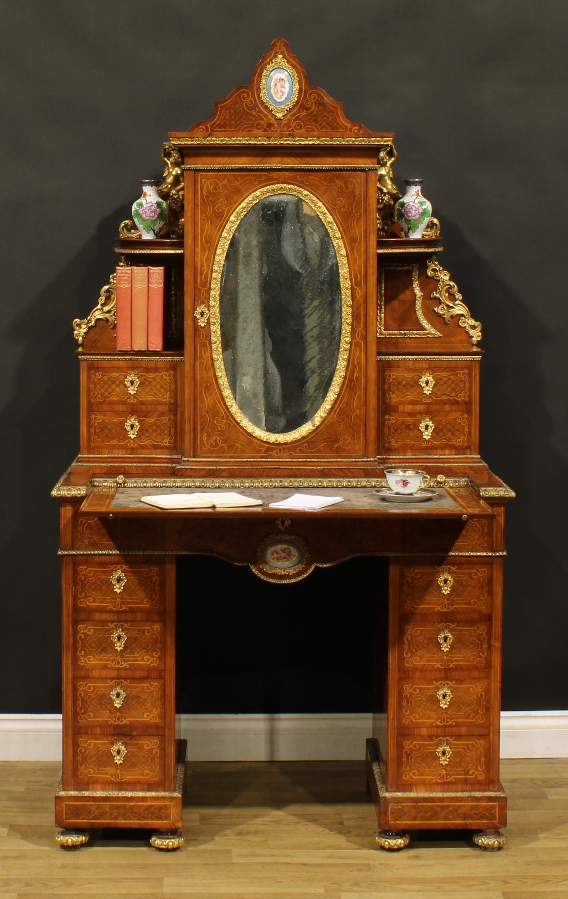 A Louis XV Revival gilt metal and porcelain mounted kingwood and marquetry exhibition-type twin
