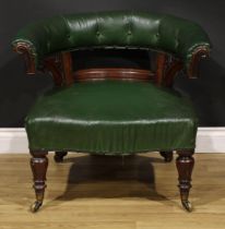 A Victorian rosewood and mahogany club library chair, stuffed-over upholstery, turned forelegs,