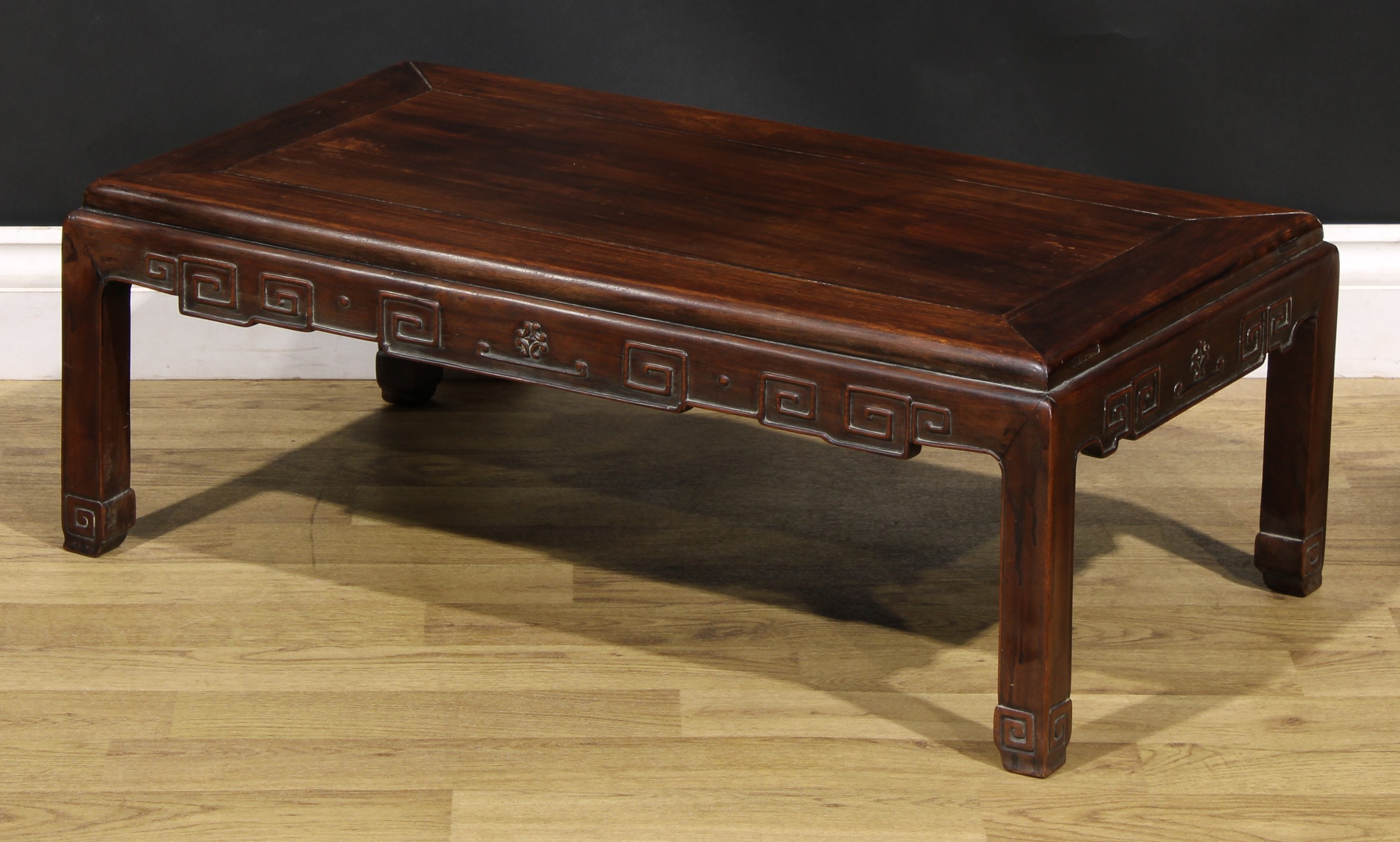 A Chinese hardwood low tea table, panel top, shaped apron carved with angular stylised clouds, - Image 4 of 5