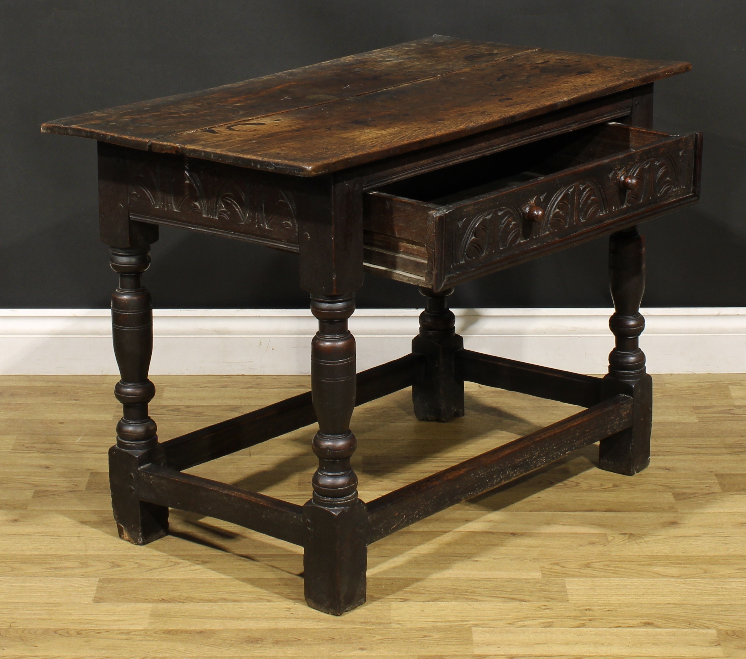 A 17th century oak side table, oversailing top above a long frieze drawer carved with leafy - Image 4 of 6