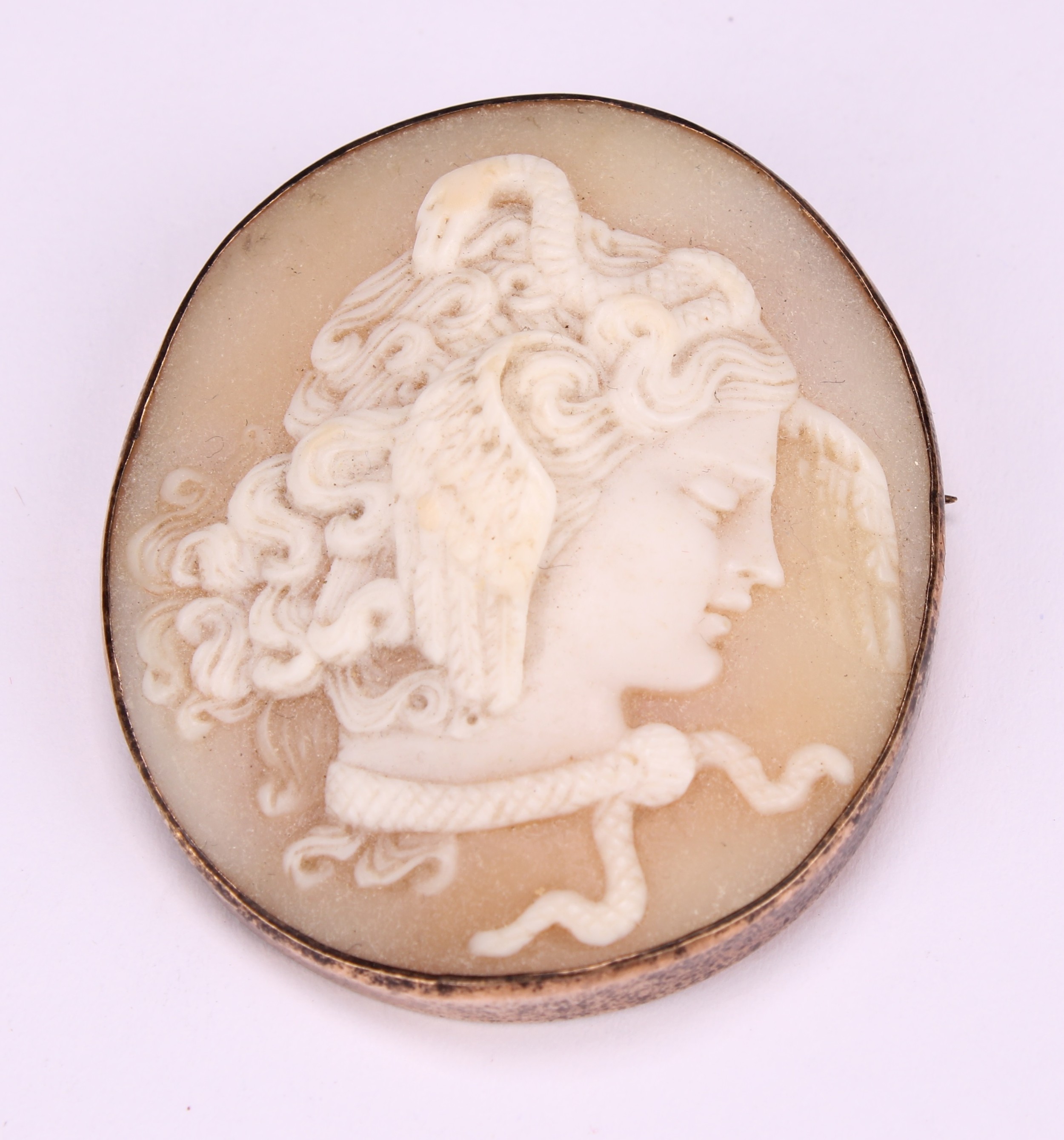 A Victorian carved cameo brooch, Medusa with serpent and winged hair, indistinctly4.5cm x 3.8cm, - Image 2 of 3