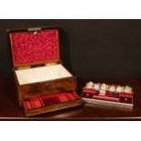 A Victorian rosewood and brass bound rectangular work box, hinged cover enclosing a fitted