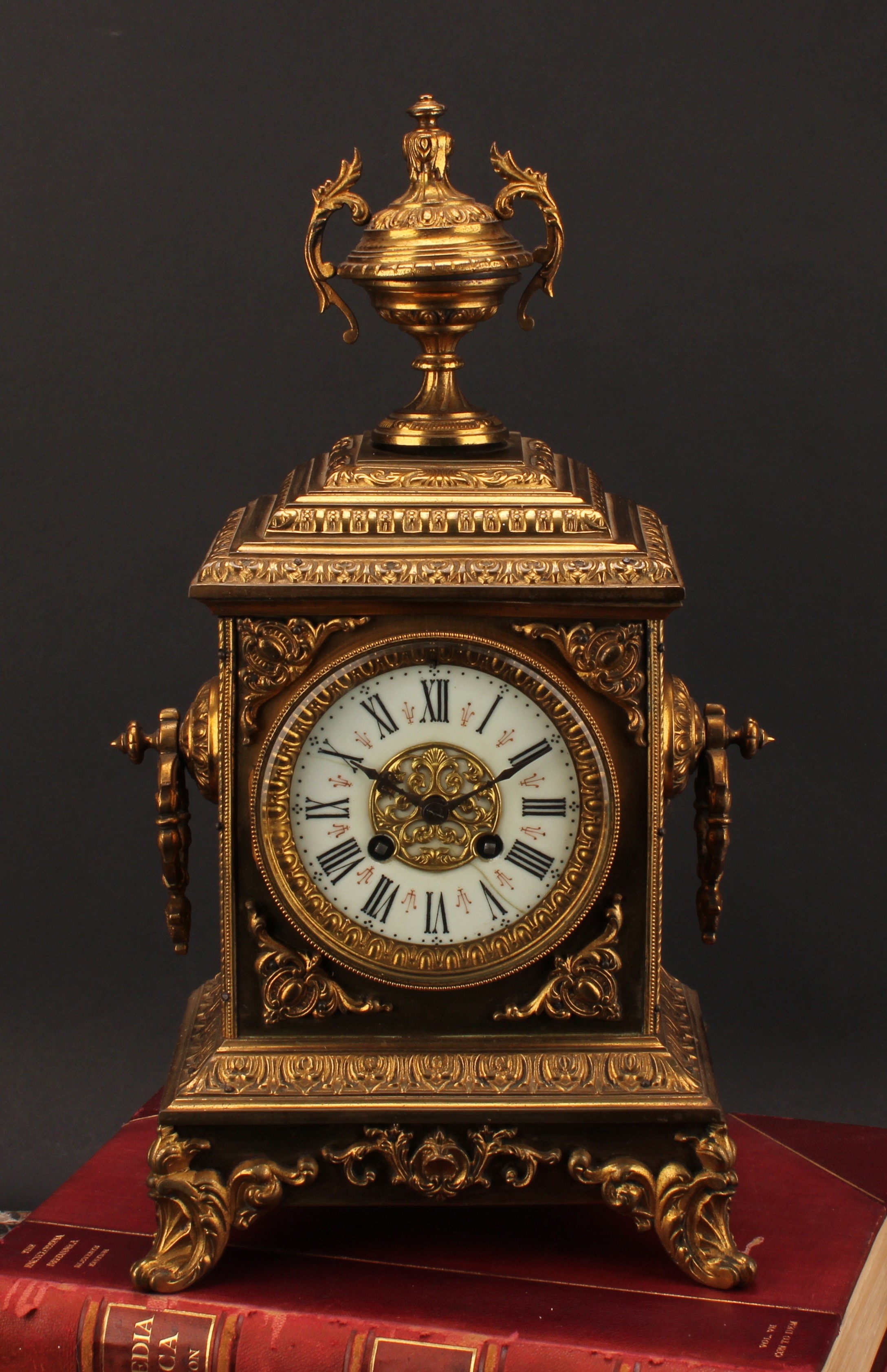 A 19th century French gilt brass table clock, 10.5cm dial inscribed with Roman numerals, twin