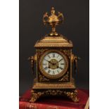 A 19th century French gilt brass table clock, 10.5cm dial inscribed with Roman numerals, twin
