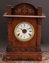 An early 20th century oak mantel alarm clock, 11.5cm circular enamel dial inscribed FATTORINI &