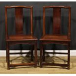 A pair of Chinese hardwood chairs, serpentine cresting rails, panelled seats, square legs,