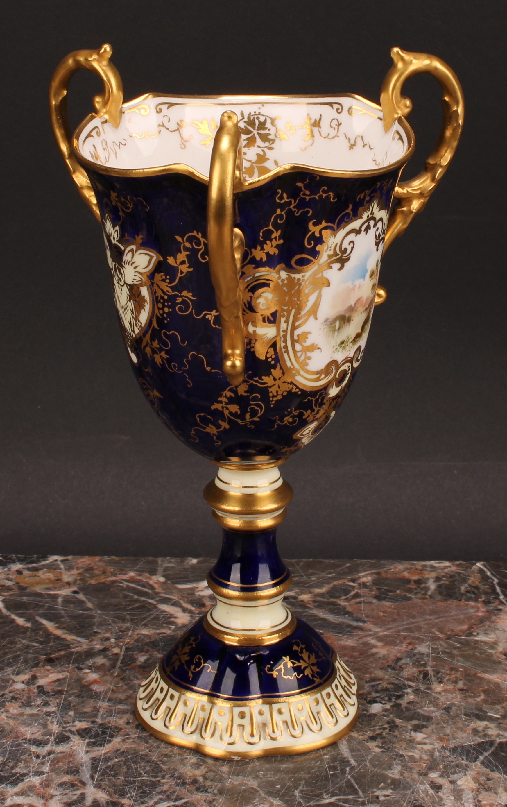 A Coalport three-handled pedestal ovoid cup or vase, painted with a landscape, within an shaped - Image 3 of 5