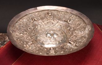 A Continental silver dish, probably German, repousse chased with mermaids, and lion and grotesque