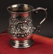 A Victorian E.P.N.S bell shaped mug, chased with birds within C-scroll cartouches flanked by
