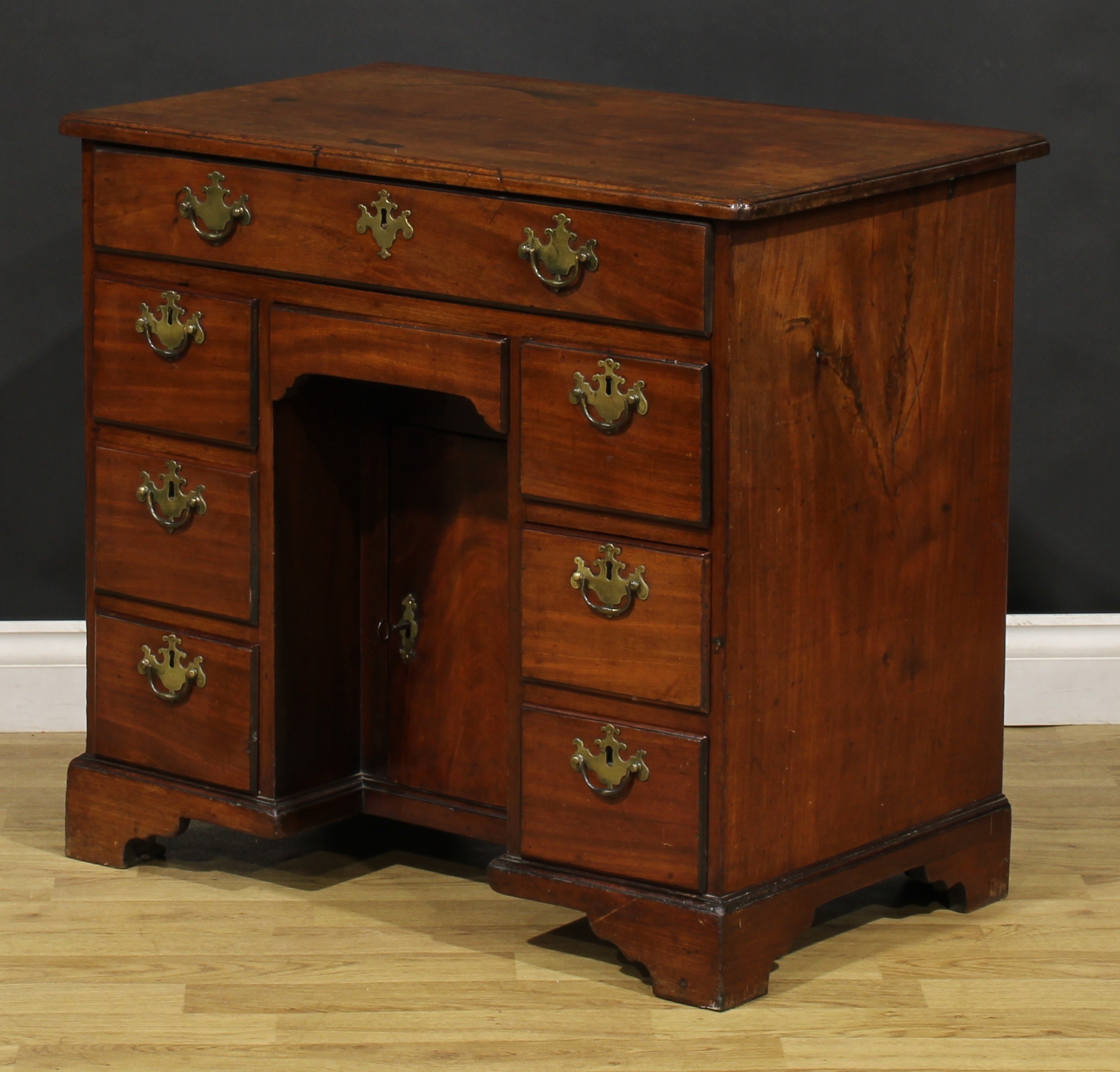 A George III mahogany kneehole desk, slightly oversailing top above an arrangement of eight drawers, - Image 5 of 6