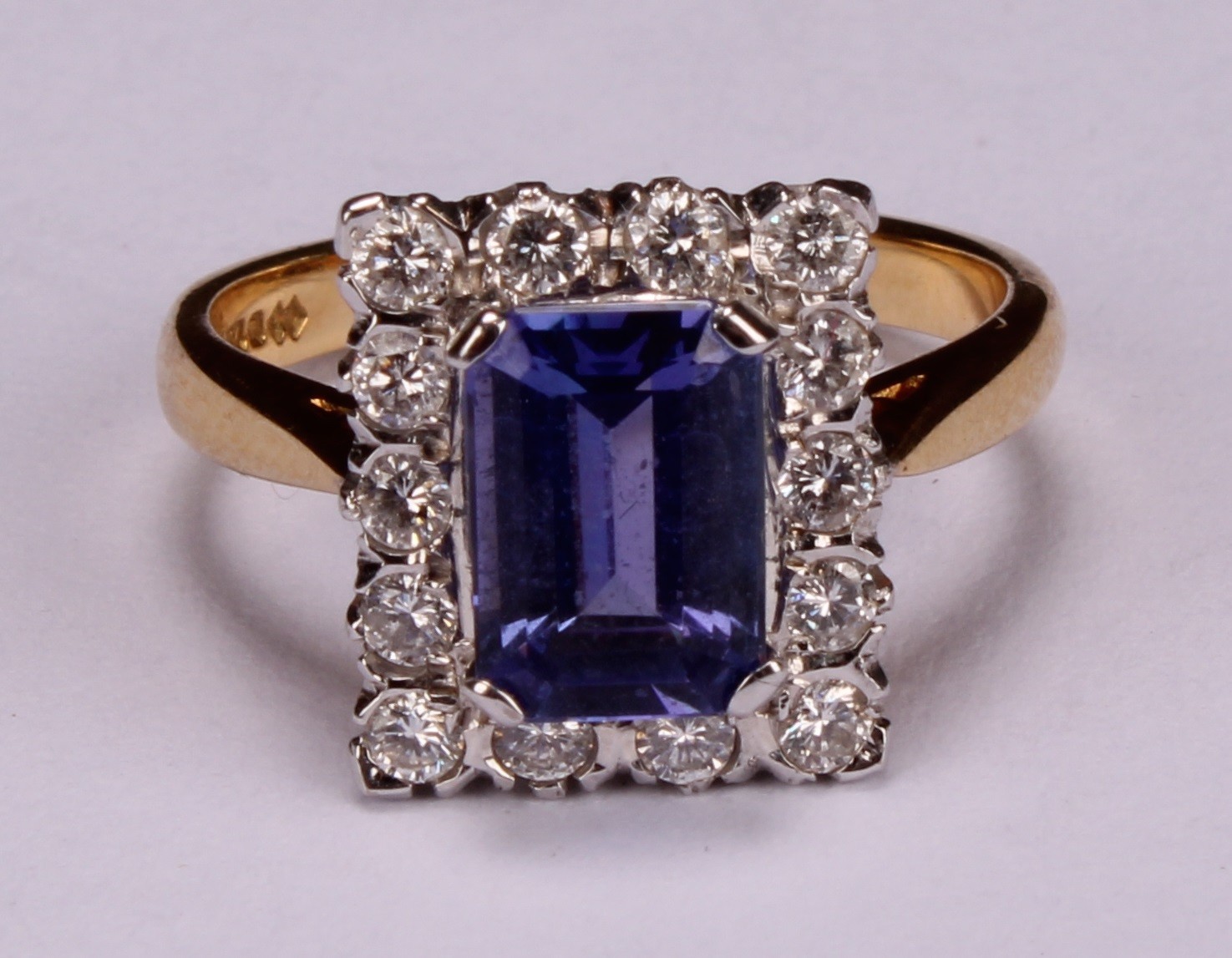A tanzanite and diamond ring, the rectangular cushion cut stone claw set within a single band of - Image 4 of 5