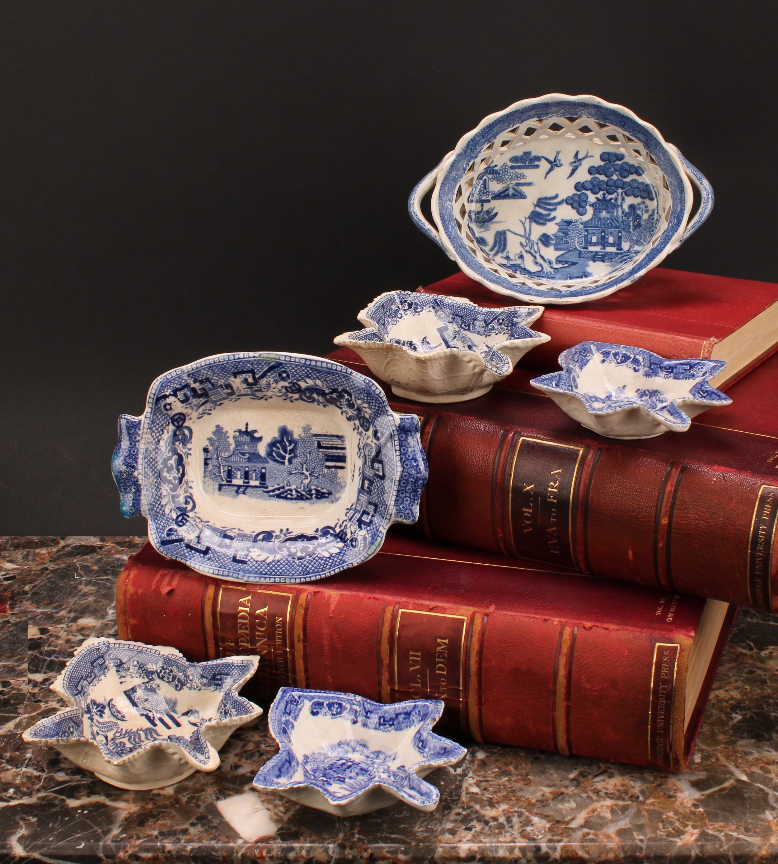 A pair of 19th century Staffordshire Willow pattern blue and white pickle dishes, 14.5cm; another