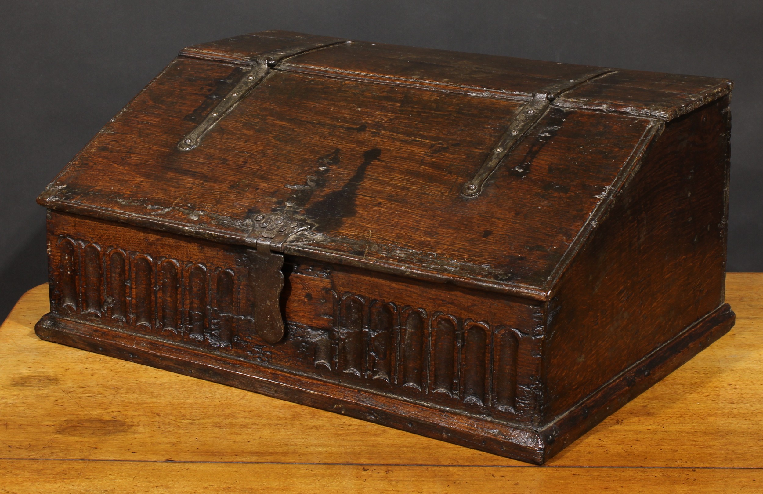 An 18th century oak boarded table box, hinged sloping top above a nulled frieze, 29cm high, 63.5cm - Image 4 of 4